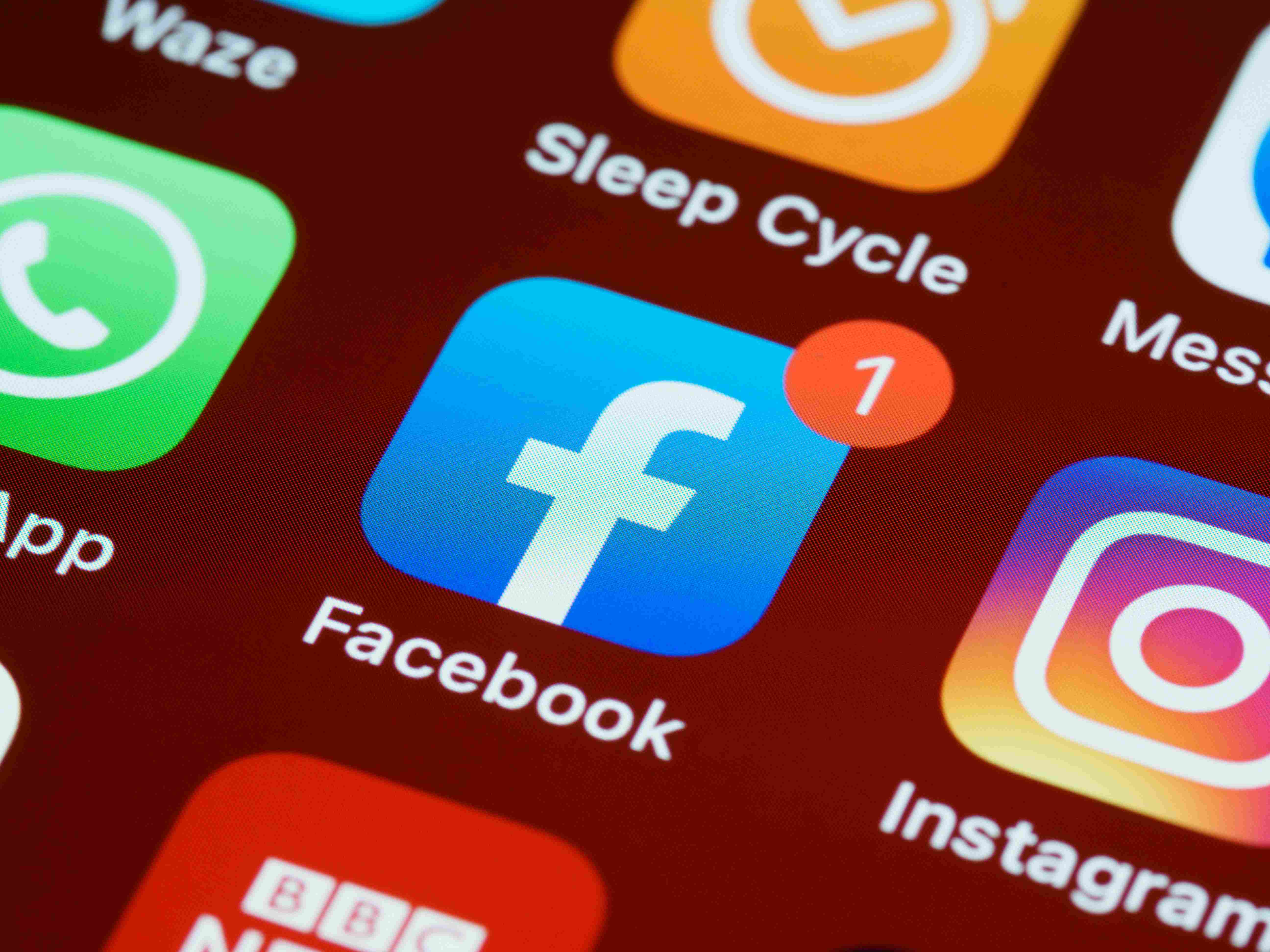 Facebook icon on phone. Photo by Brett Jordan on Unsplash